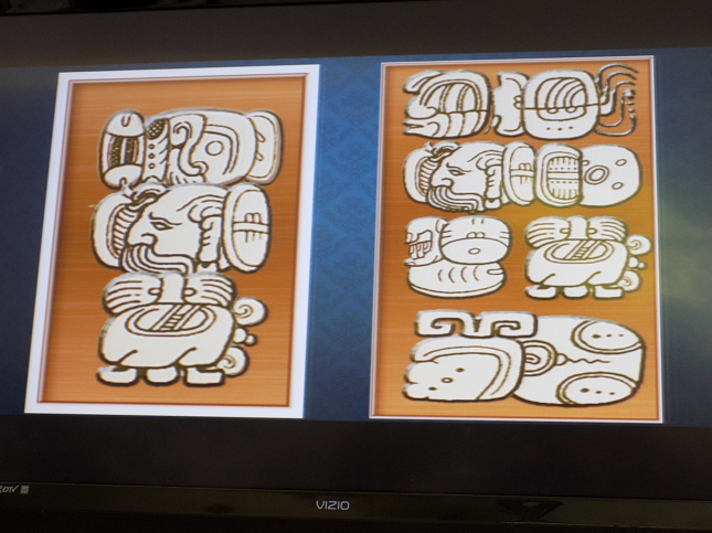 Poster from the Ko’ox Kanik Maaya school program.  Left side: ko-o-ne-e-xa ka-ni-ki ma-ya; Ko’one’ex kanik Maya; “Let’s learn Maya.” Right side: ta-na i-ni ka-ni-ki tz’i-bi ye-te-le ma-ya wo-jo-bo; Tan in kanik tz’ib yetel Maya wojo’ob; “I am learning ancient writing with Maya glyphs.”