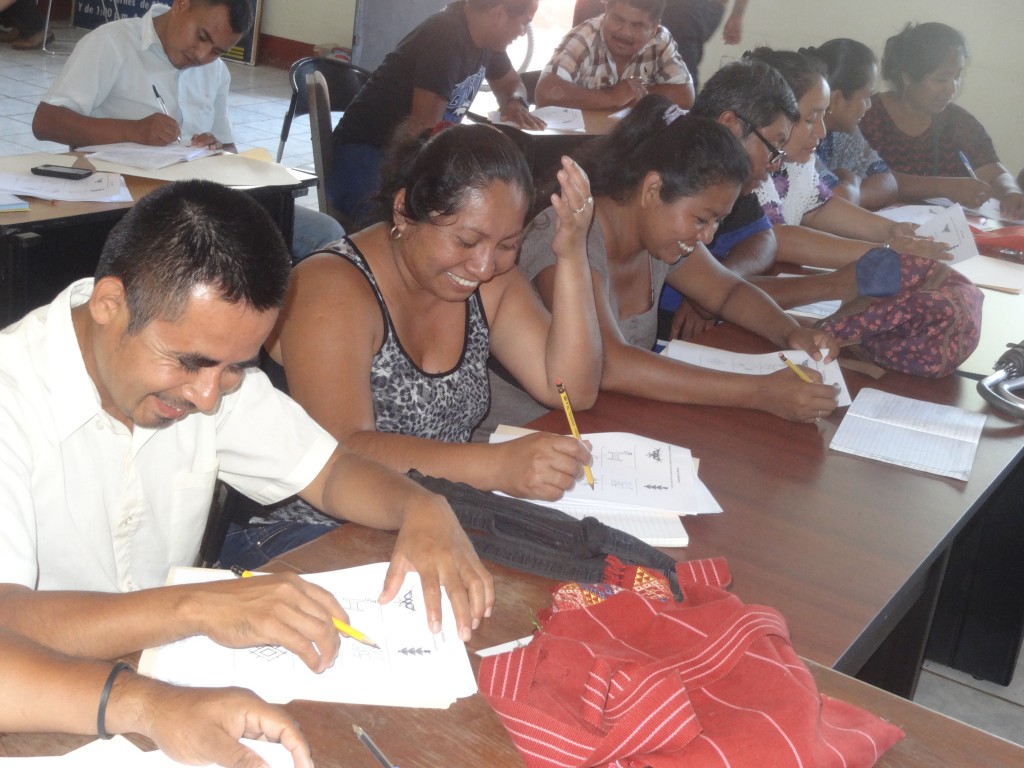 Group of teachers doing exercises in the Tz'iib reading and writing System.