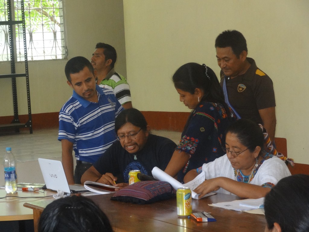 Hector Xol reviewing exercises performed by teachers.