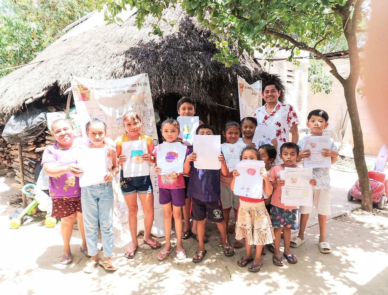 A group of children holding up signs

Description automatically generated