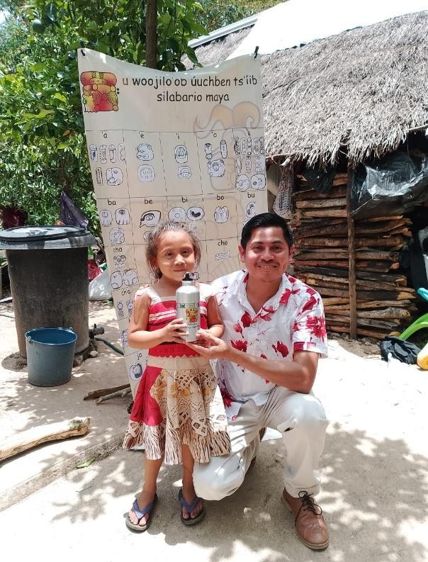 A person and a child posing for a picture

Description automatically generated