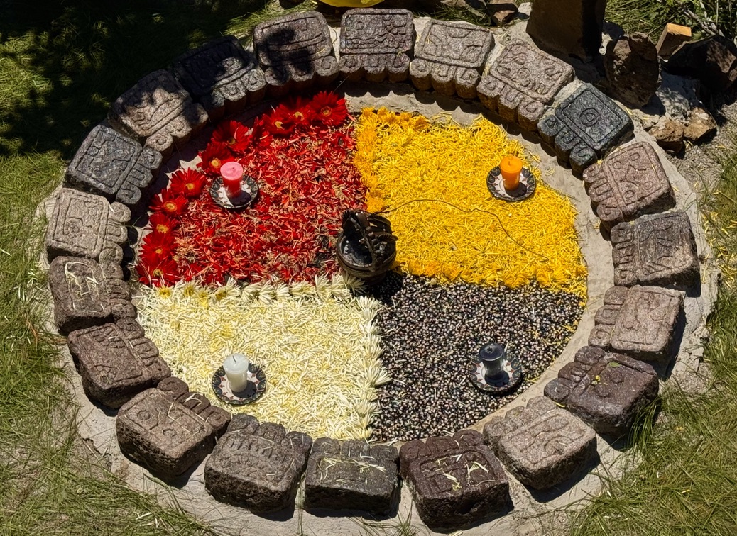 A circular clock made of stones

Description automatically generated